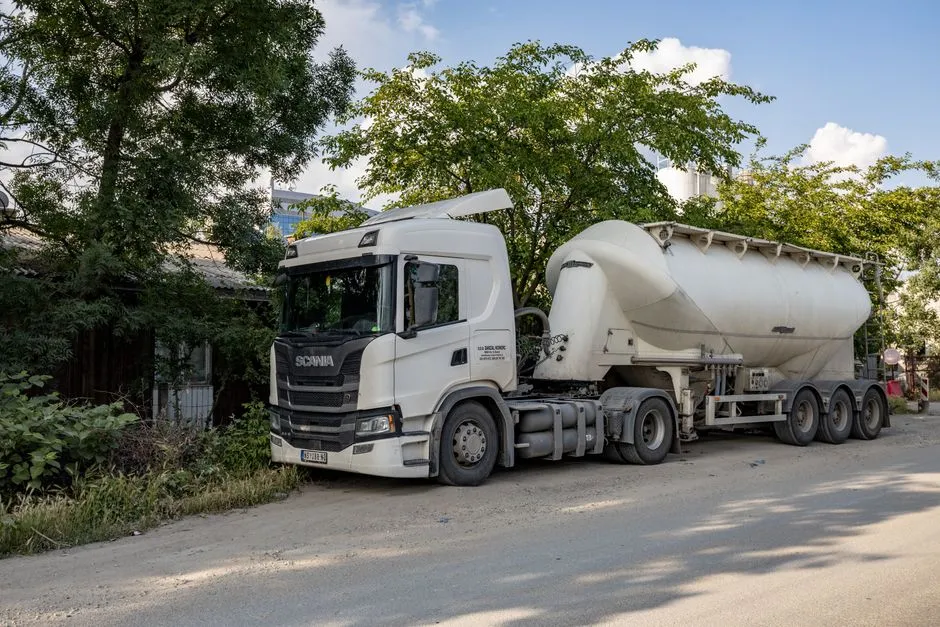 Tanker truck parked on the side of a road