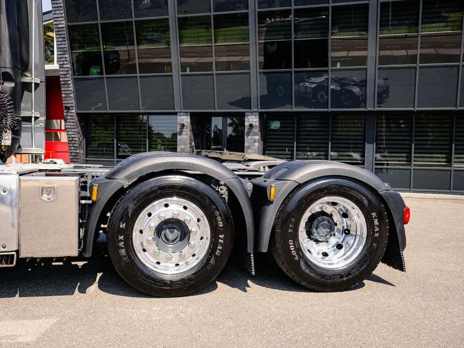 Close-up of a heavy truck's wheels and air brake hardware